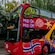 A Hop On, Hop Off double decker sightseeing bus with an open top